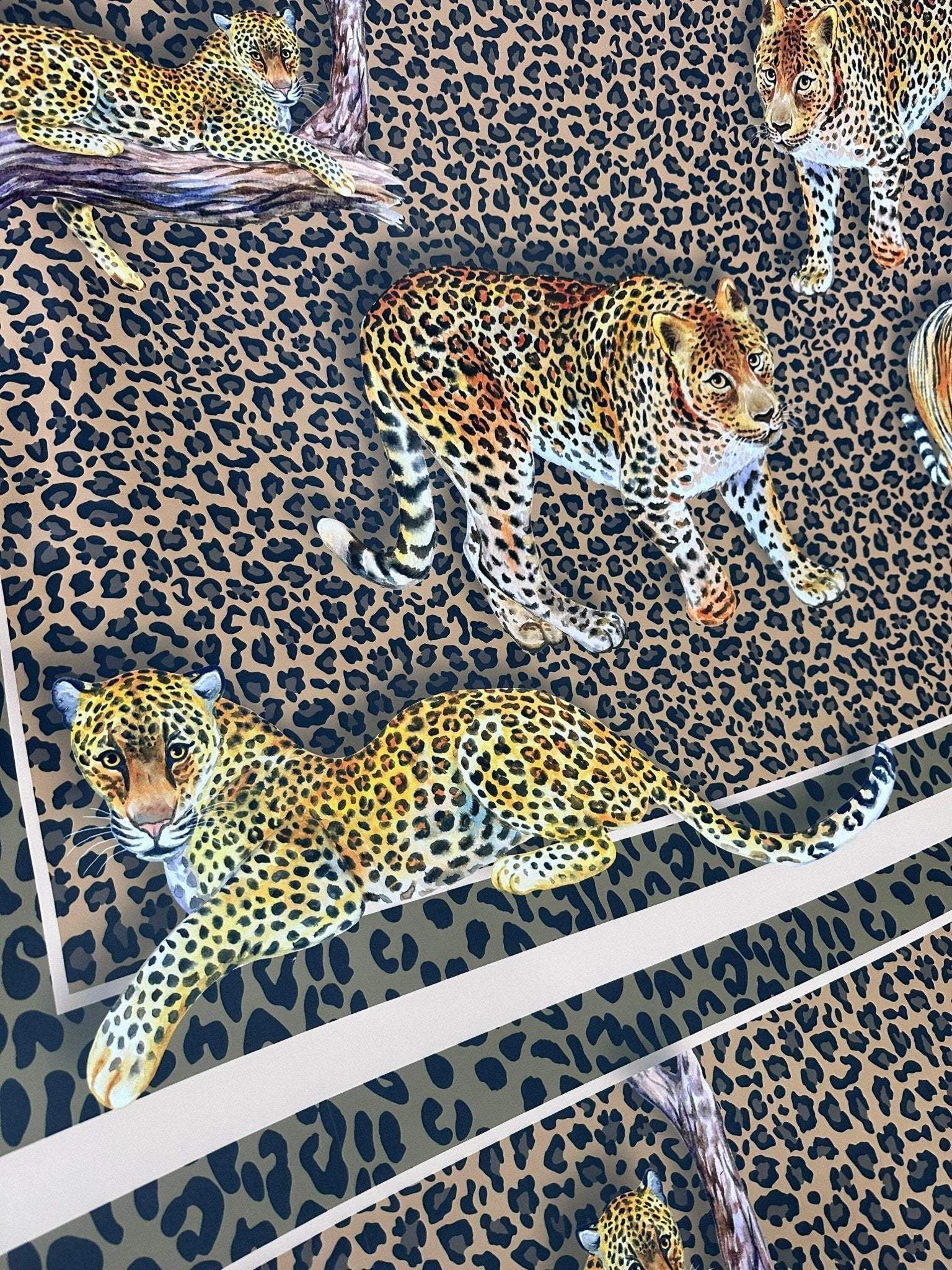 Close-up of leopard print crepe fabric with detailed leopard illustrations on a spotted background