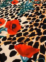 leopard poppy flower silky crepe fabric with vibrant red poppies and leopard print pattern