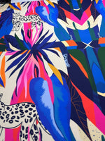 Bright leopard and tropical pattern fabric with vibrant blue, pink, and green leaves and leopard illustrations, 150cm wide