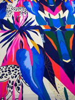 Colorful leopard and tropical pattern fabric with vibrant blue, pink, and green leaves and animal prints