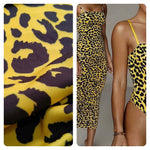 Yellow and black leopard pattern stretch fabric and a fitted dress made from the same fabric