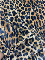 Leopard pattern stretch velvet fabric with soft, lightweight, wrinkle-free texture ideal for stylish clothing and accessories