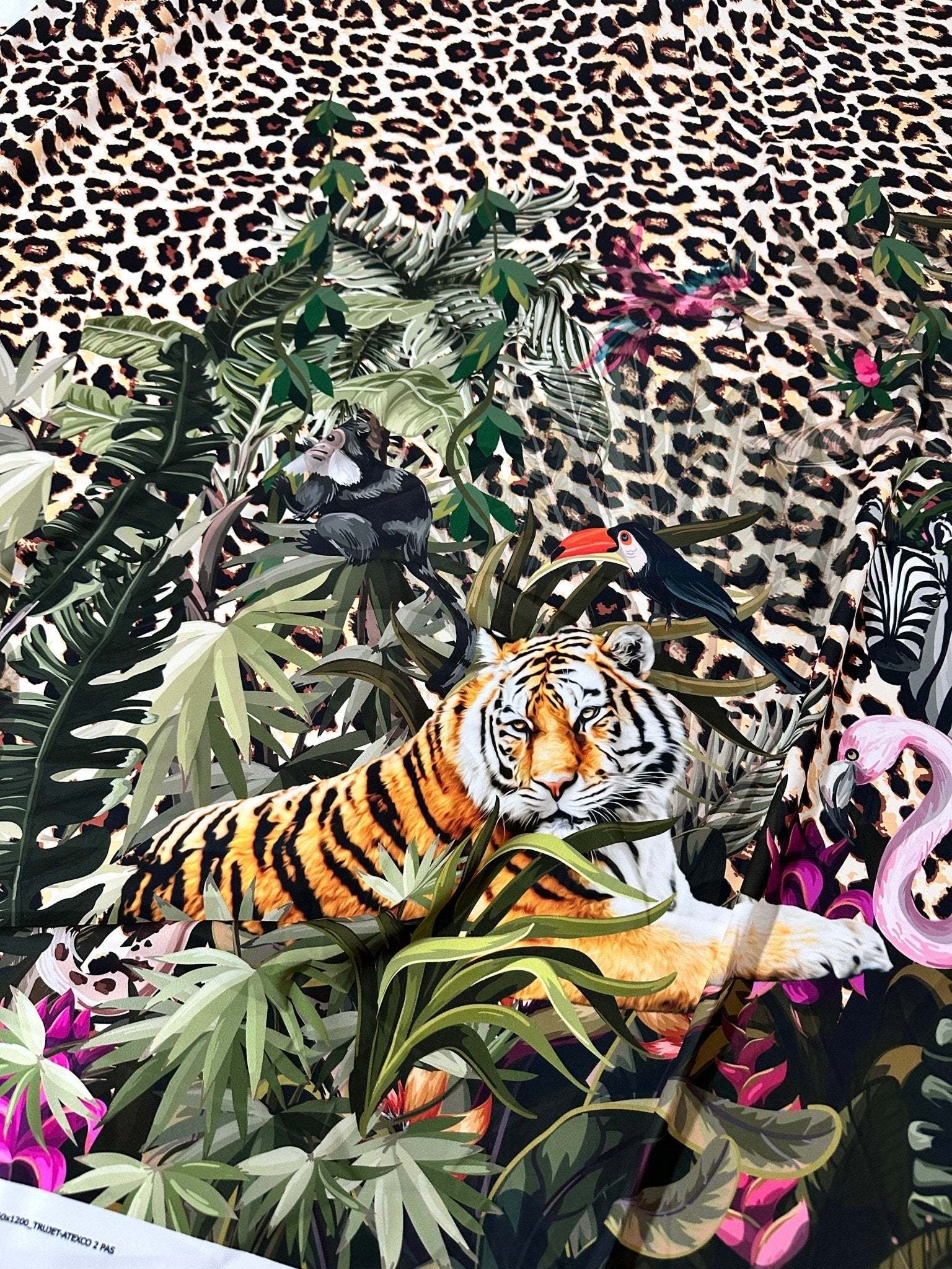 Leopard tropical leaf pattern fabric with jungle animals and leopard print background