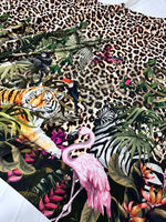 Leopard tropical leaf pattern fabric featuring jungle animals and vibrant foliage design