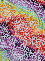 Colorful leopard print fabric with vibrant animal pattern for sewing projects and accessories
