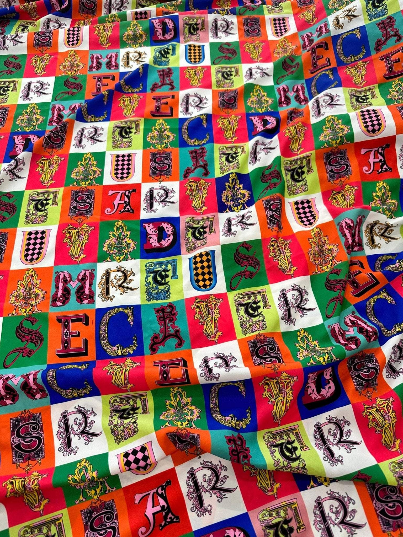 Colorful letter print cotton fabric with decorative alphabet blocks for sewing and crafting projects