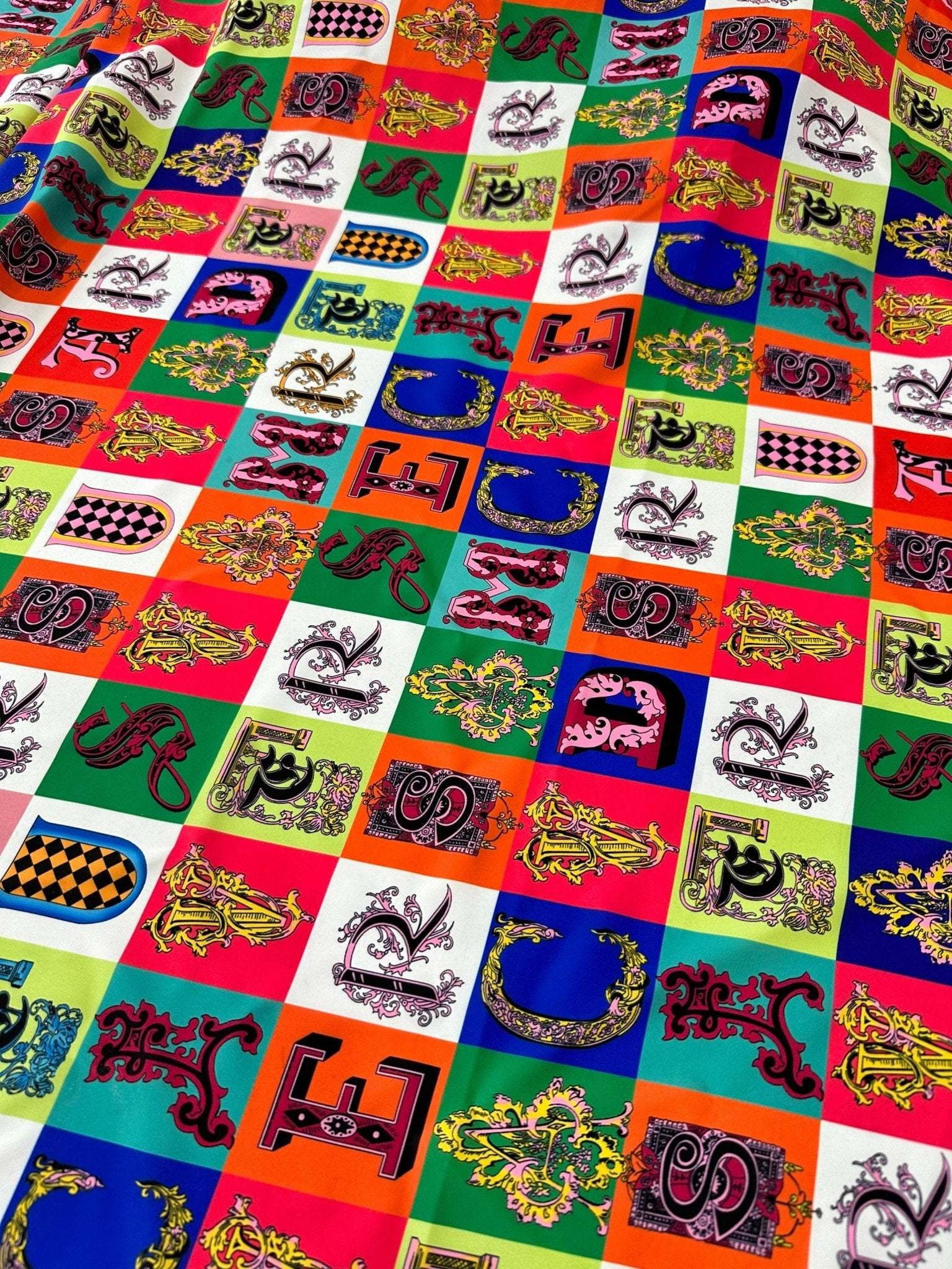 Colorful letter print cotton fabric with various decorative alphabet blocks for sewing and crafting projects