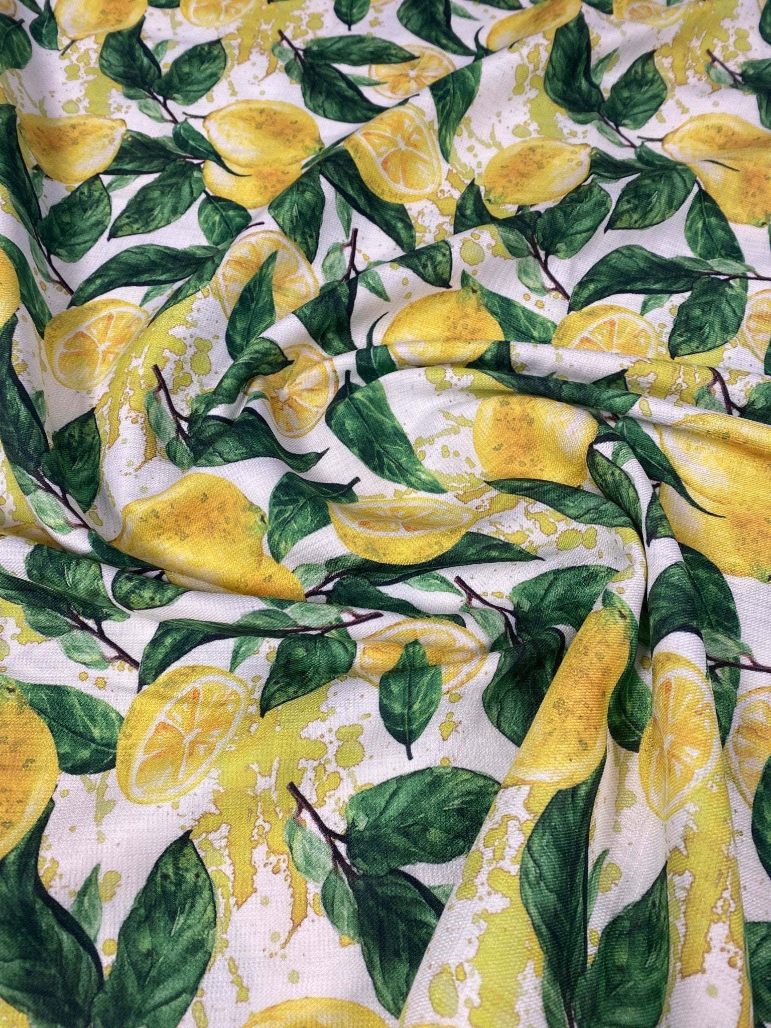 Limon Design Linen Fabric with vibrant yellow lemon and green leaf pattern on soft polyester blend for home decor and fashion projects