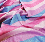 Lurex striped glitter fabric with shimmering pink, purple, and blue stripes and 4-way stretch for activewear and costumes