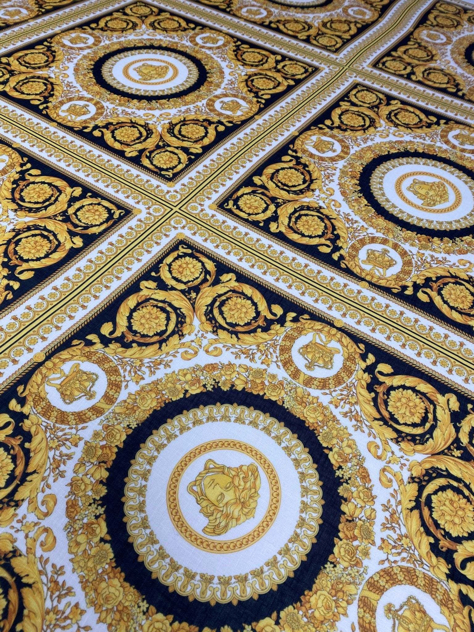 Luxurious Baroque Medusa black and gold fabric with intricate ornate pattern for upholstery and fashion