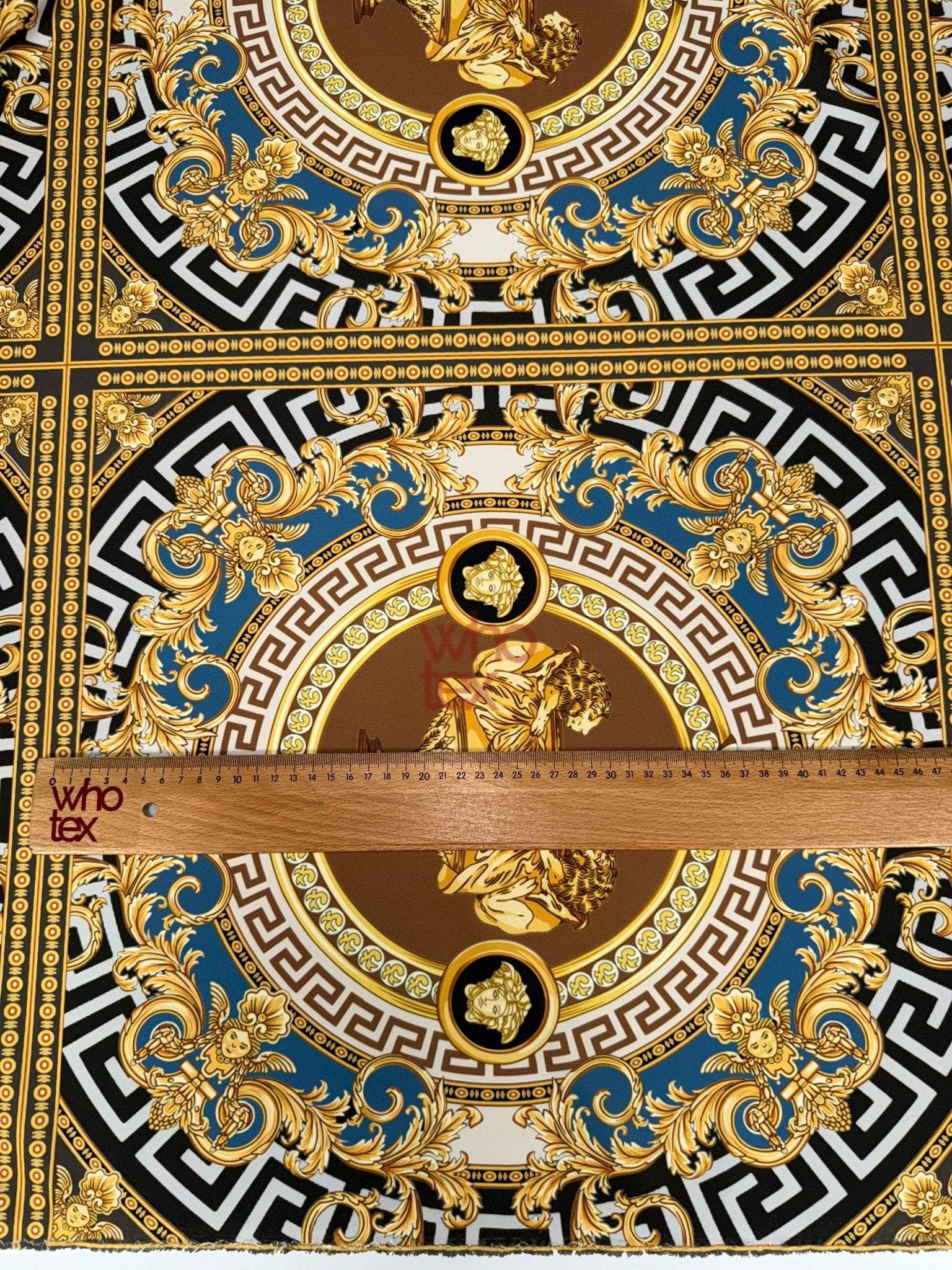 Gold and blue ornate pattern luxury Baroque design fabric with intricate gold detailing and classical motifs