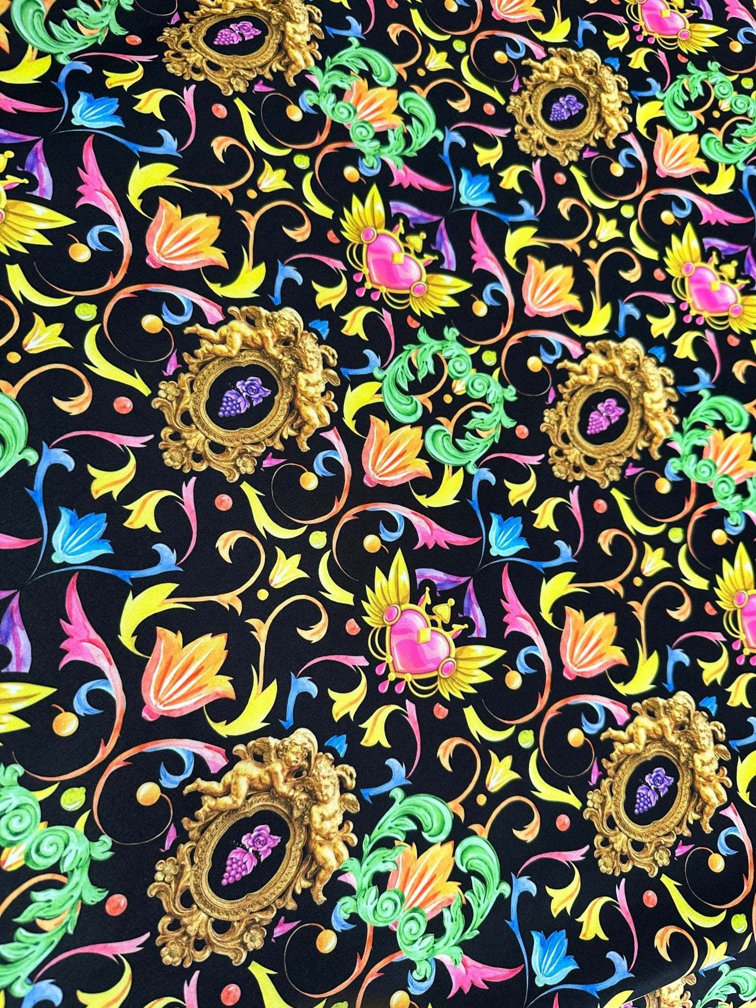 Vibrant black fabric with colorful baroque floral and heart pattern for crafting and upholstery