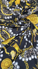 Black luxury baroque fabric with gold chain, leopard print, and pearl design