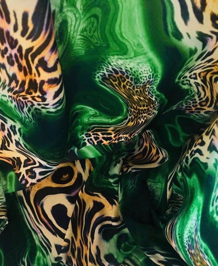 Luxury green leopard print fabric with emerald swirls and exotic animal pattern, 150cm width