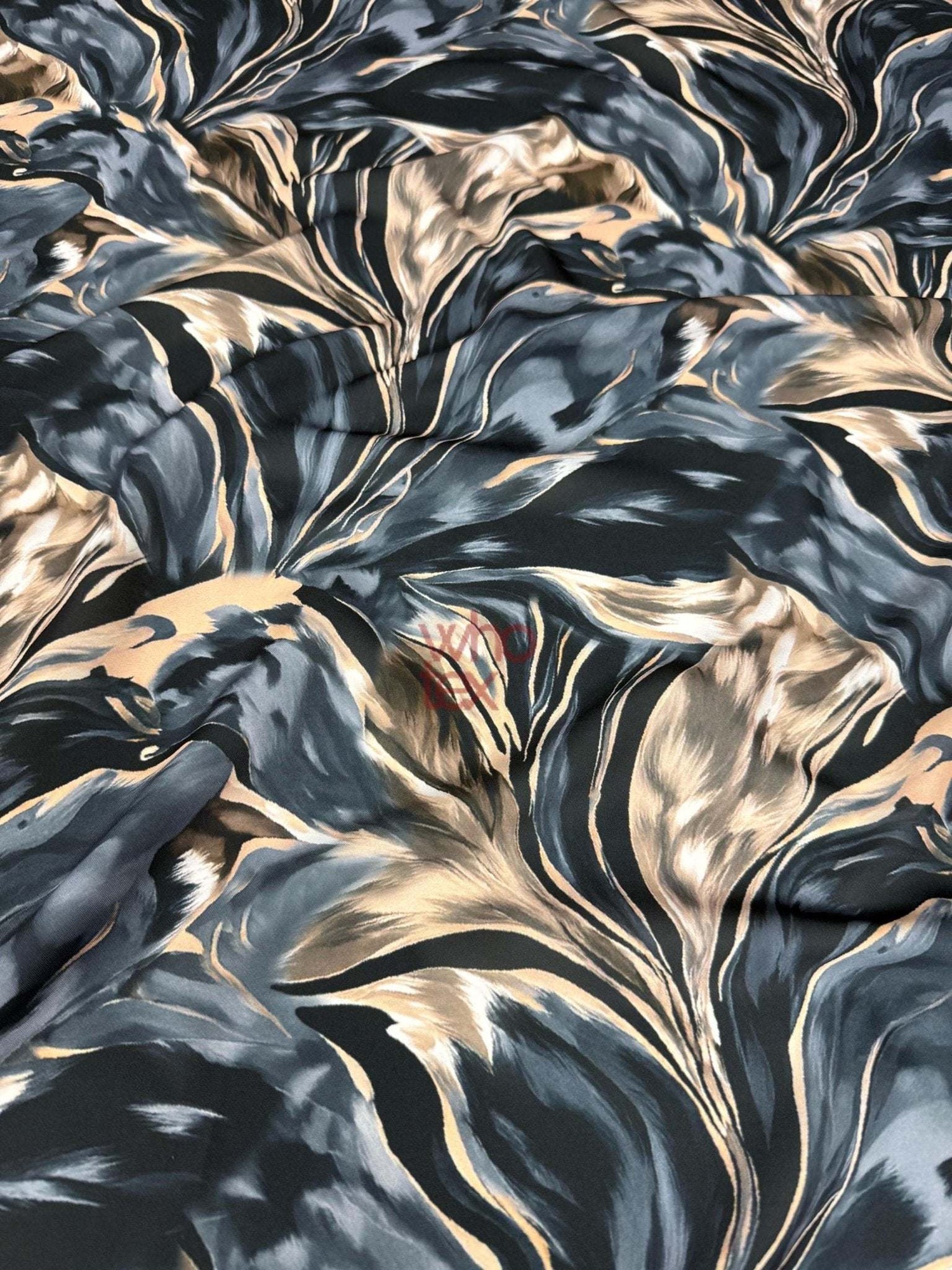 Dark blue and beige marble print satin fabric with smooth texture and elegant drape