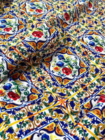 Close-up of Majolica Pattern Luxury Fabric with colorful digital print featuring intricate floral and geometric designs on durable high-quality material.
