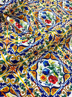 Majolica Pattern Luxury Fabric with vibrant floral and geometric digital print in blue, yellow, red, and green colors on high-quality material.