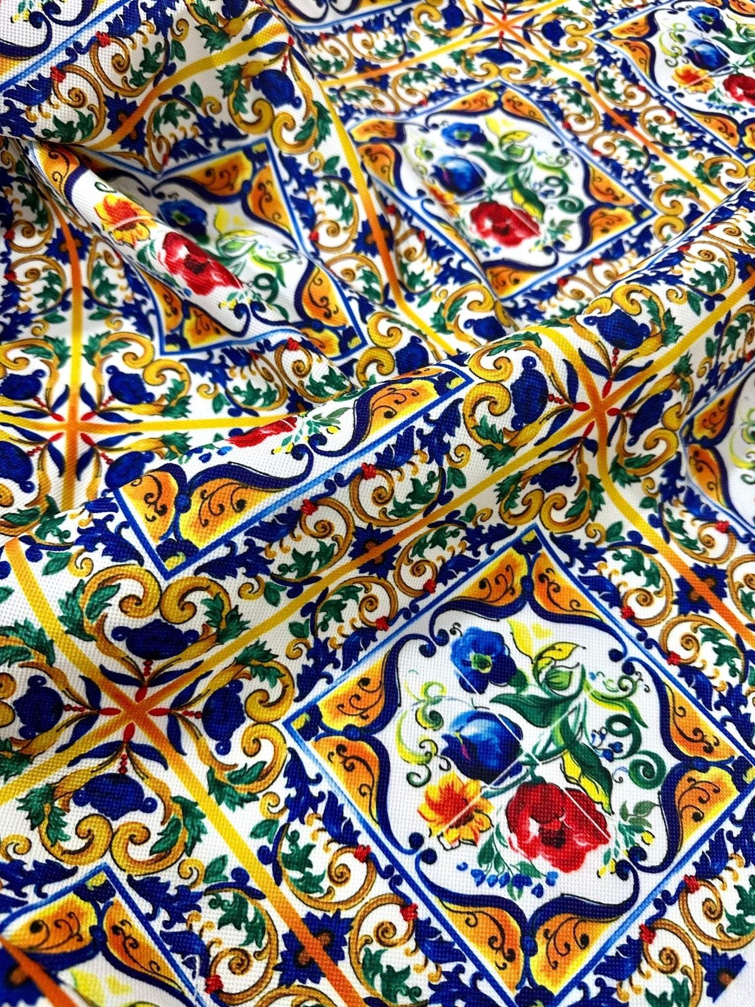 Majolica Pattern Luxury Fabric with vibrant floral and geometric digital print in blue, yellow, red, and green colors on high-quality material.