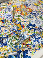 Colorful Majolica pattern fabric with intricate tile designs, ideal for sewing crafts and decorative projects.