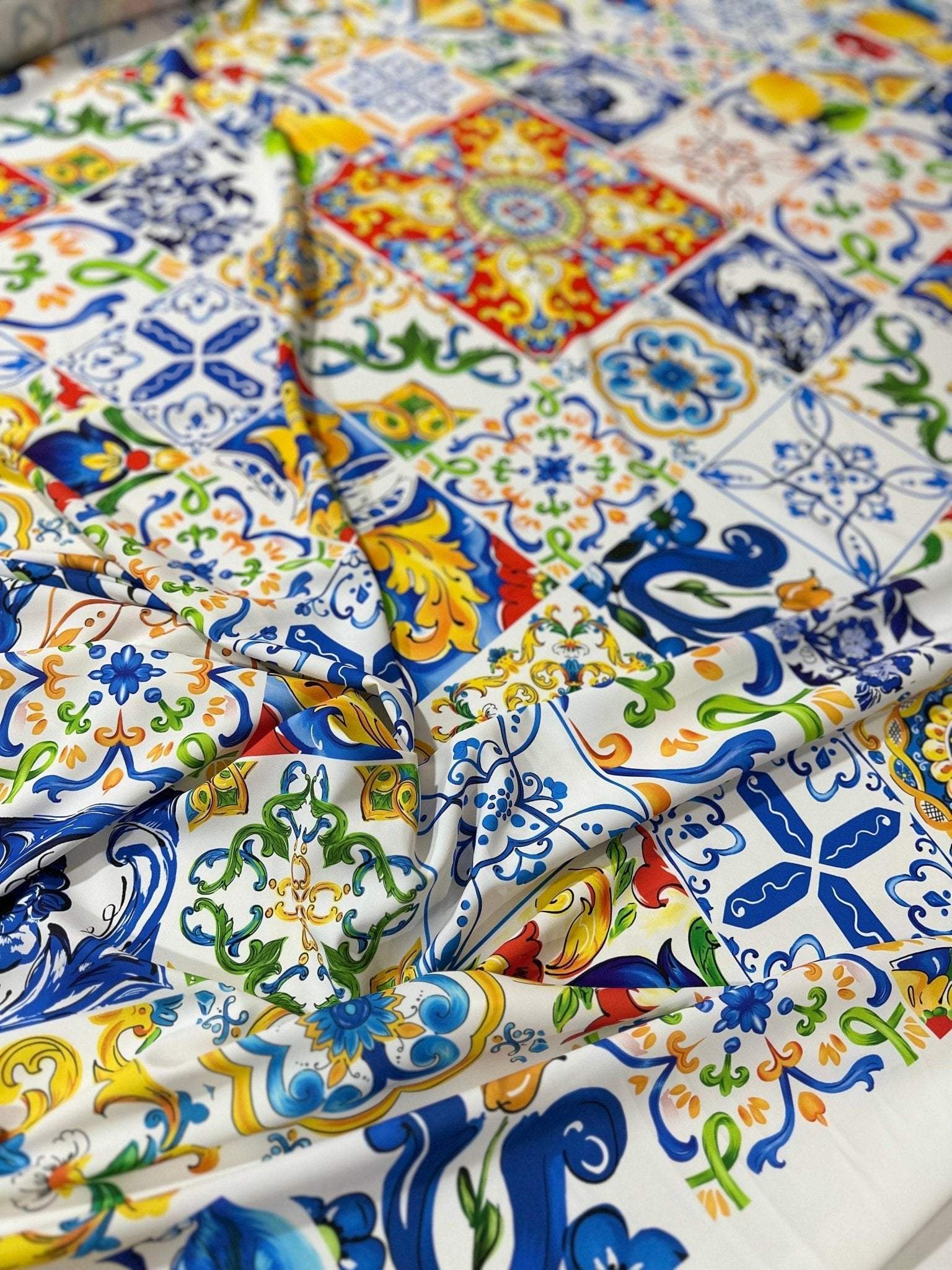 Colorful Majolica pattern fabric with intricate tile designs, ideal for sewing crafts and decorative projects.