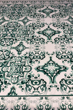 Green and white Majolica pattern fabric with intricate elegant swirl designs for home decor and upholstery projects