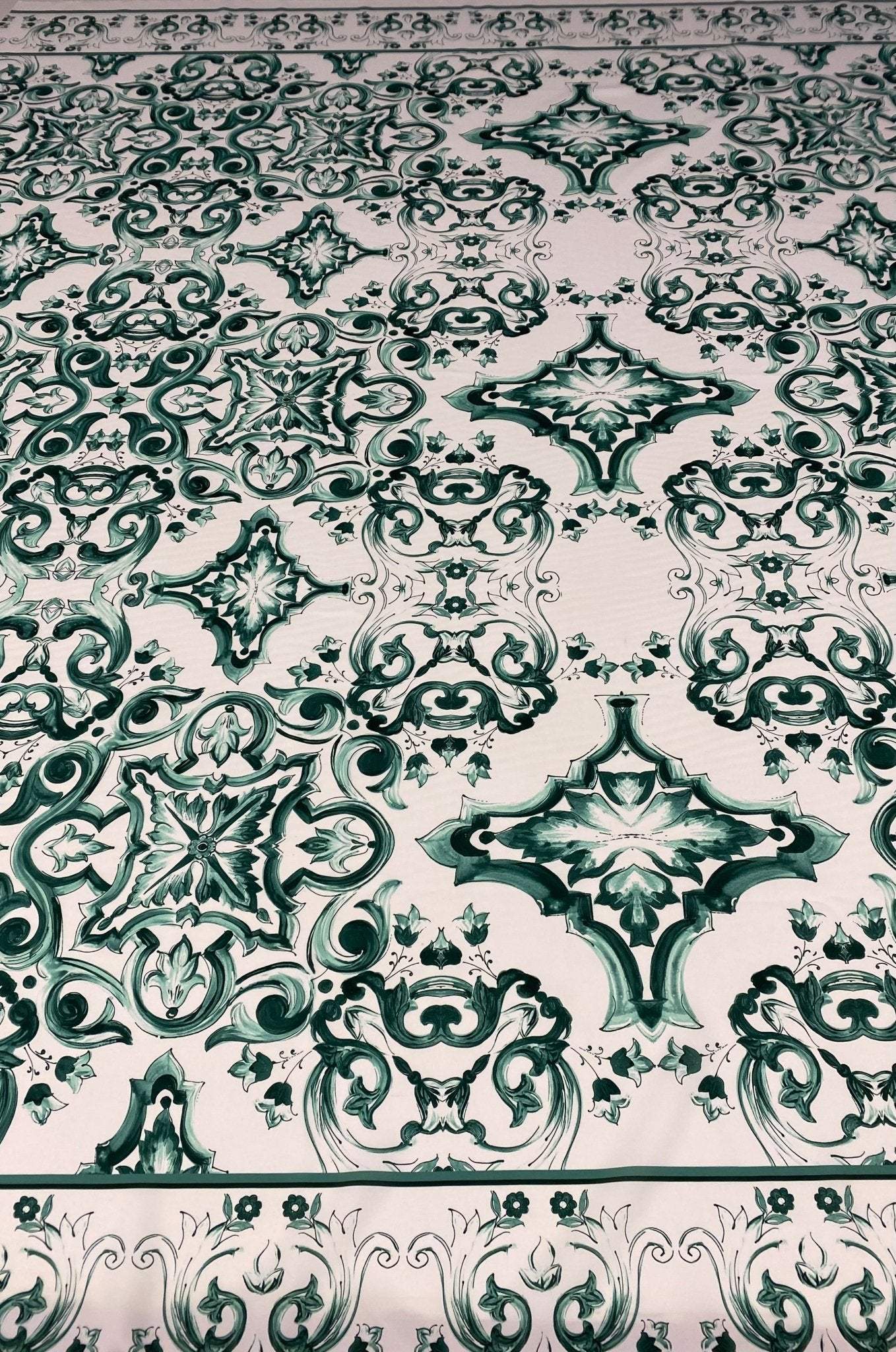 Green and white Majolica pattern fabric with intricate elegant swirl designs for home decor and upholstery projects