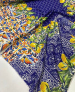 Majolica lemon pattern fabric with vibrant yellow lemons and intricate blue and orange tile-inspired designs, 150cm wide