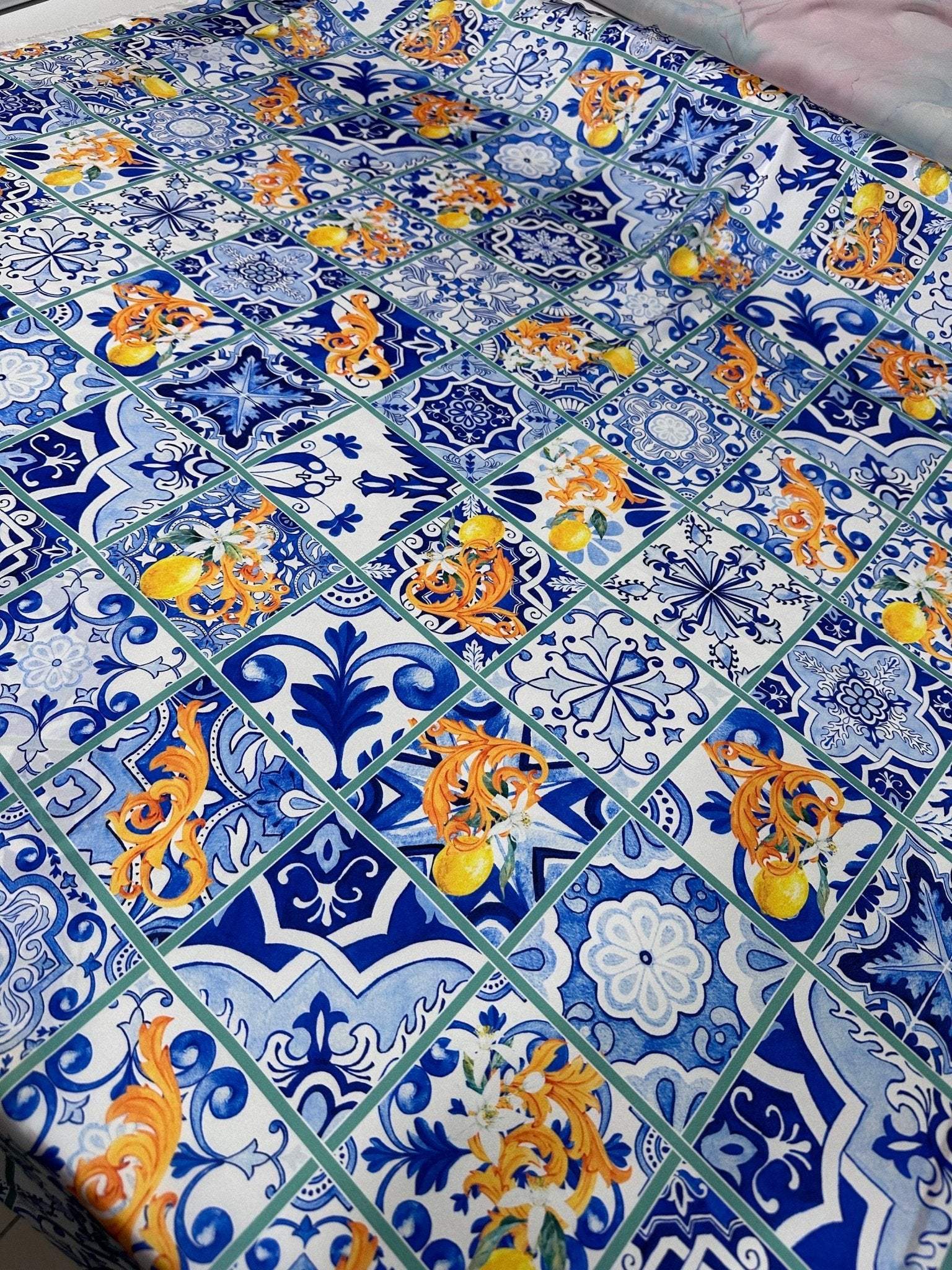 Majolica Lemons luxury fabric with traditional blue tile and vibrant lemon pattern for upholstery and decor