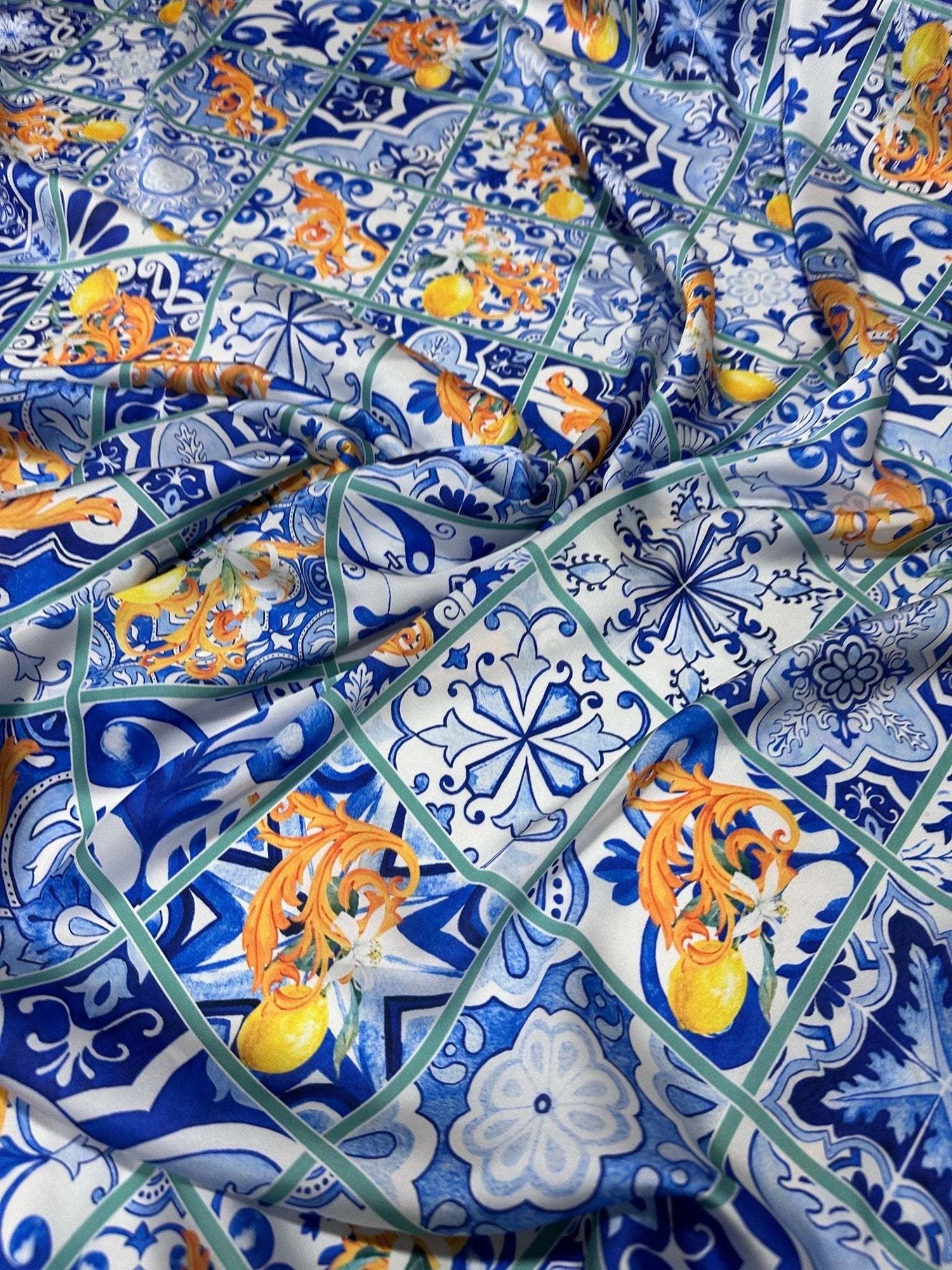 Majolica Lemons Luxury Fabric with vibrant lemon and traditional blue tile pattern