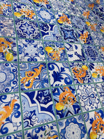 Majolica Lemons Luxury Fabric with vibrant blue and orange lemon-inspired tile pattern, ideal for upholstery and drapery.