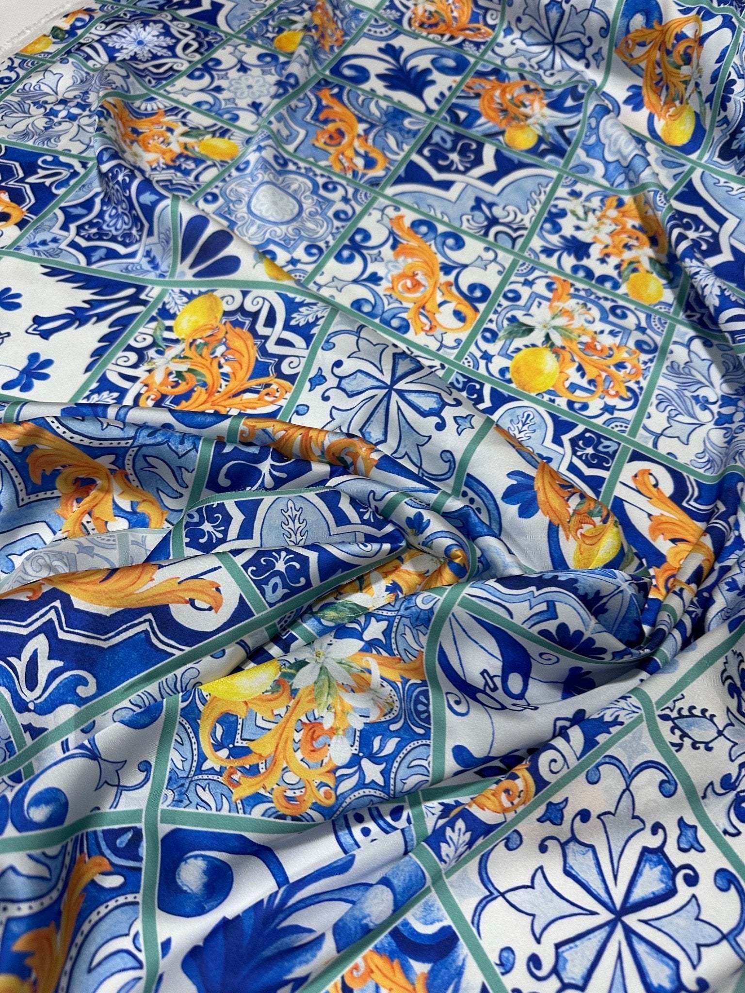 Majolica Lemons luxury fabric with vibrant lemon and traditional blue tile pattern, 150cm width textile for upholstery and drapery