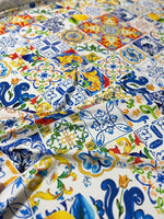 Luxury Majolica pattern fabric with vibrant blue, yellow, and green tile-inspired designs, ideal for upholstery and drapery.