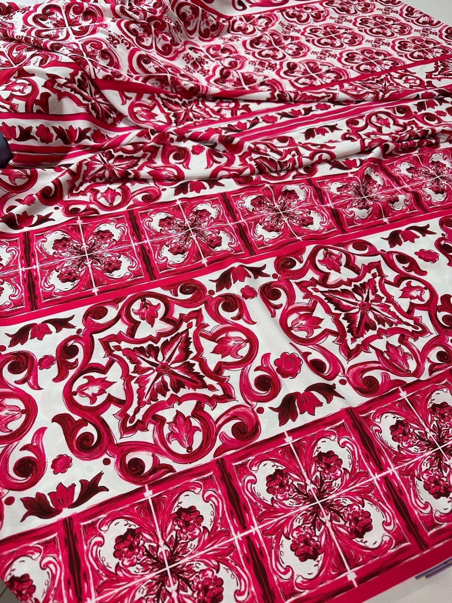 Pink Sicilian Majolica pattern fabric with intricate floral and geometric designs on white background