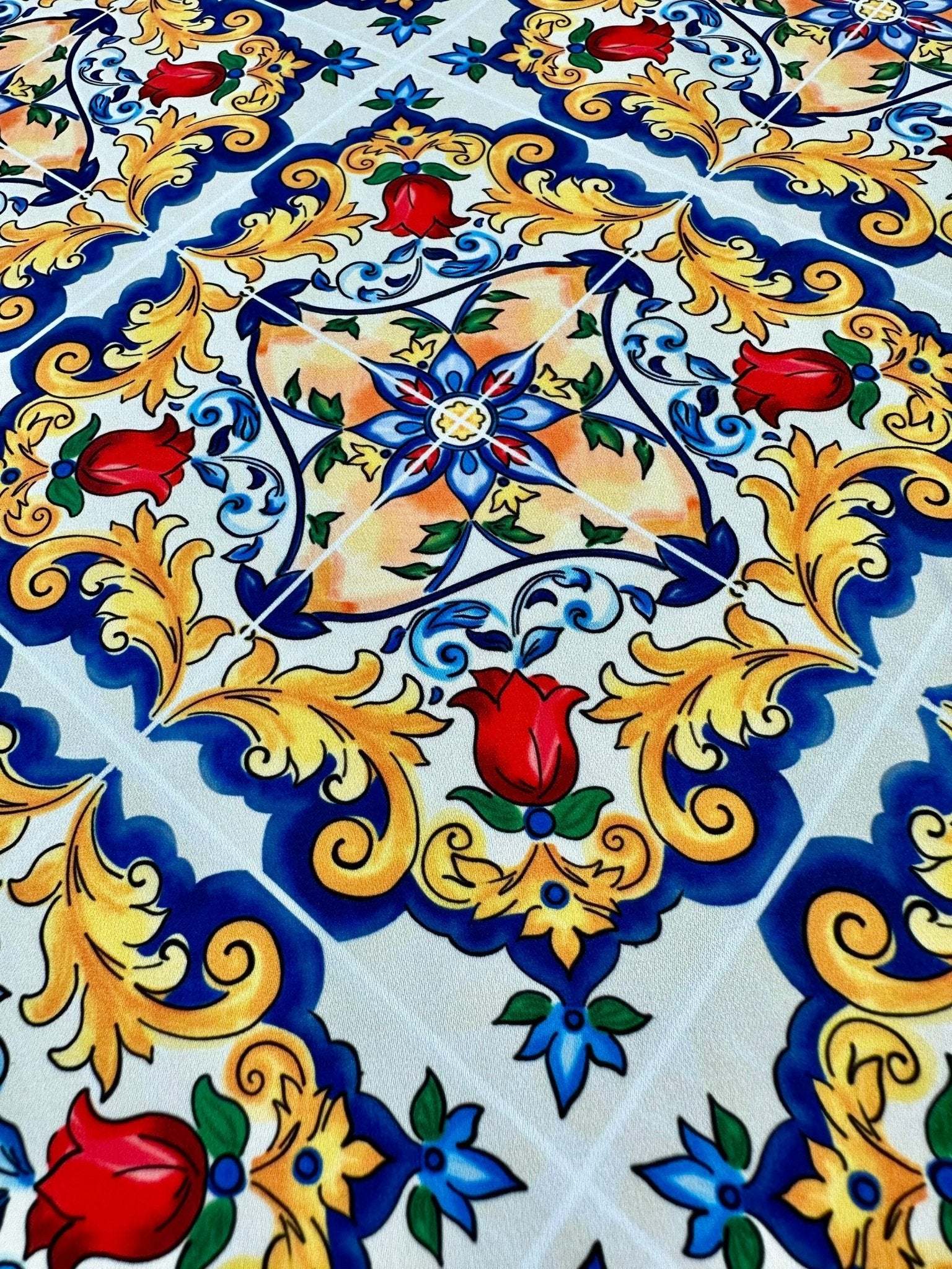 Majolica Pattern Fabric with vibrant Sicilian-inspired floral and ornamental design in blue, yellow, and red colors