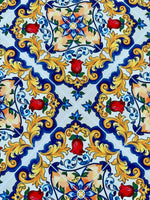 Bright Sicilian Majolica pattern fabric with intricate floral and ornamental designs in blue, yellow, red, and green colors