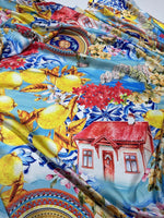 Vibrant Majolica Sicilian print fabric with lemons, flowers, and traditional motifs on blue background