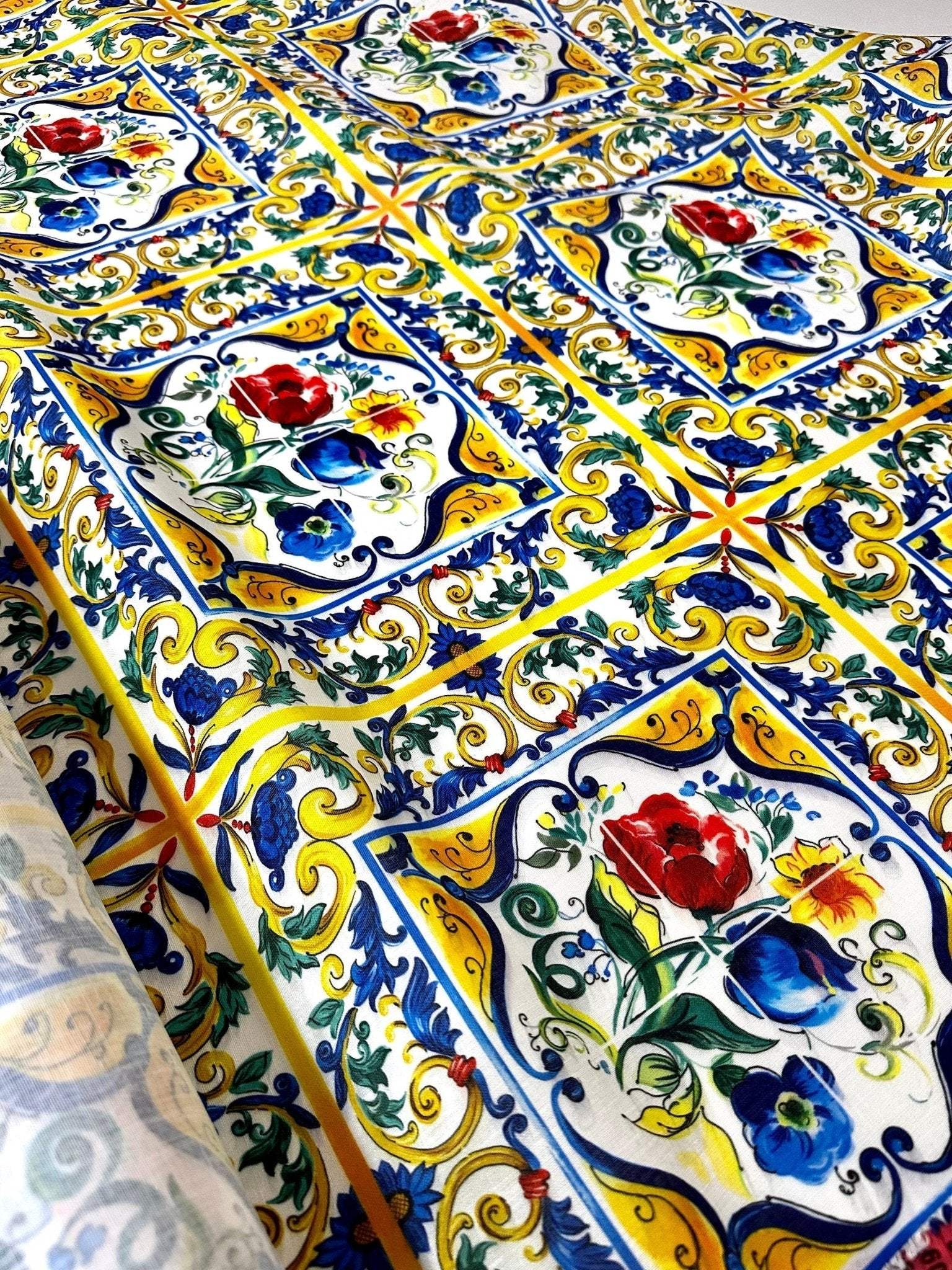 Blue and yellow floral Majolica pattern fabric with red and blue flowers and intricate decorative details