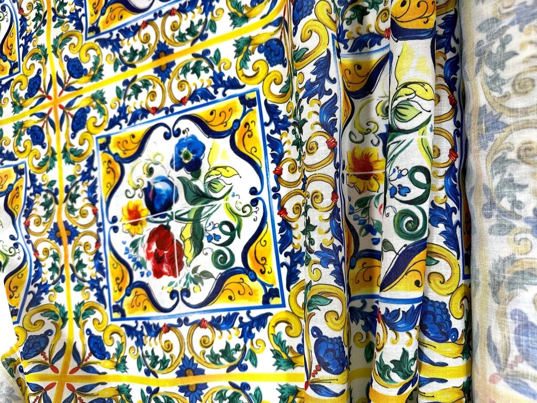 Blue and yellow floral majolica pattern fabric with intricate tile-inspired design and vibrant colors