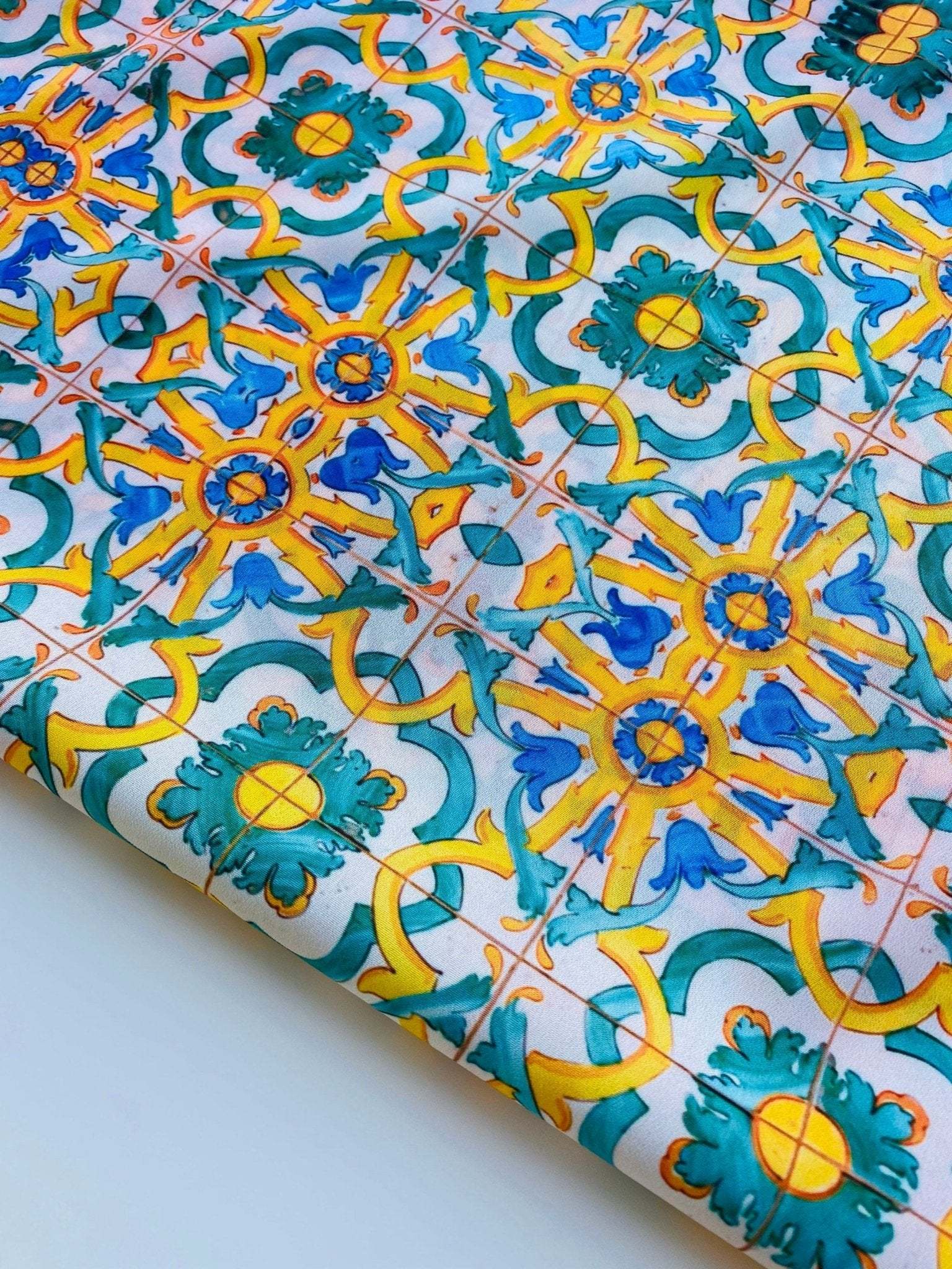 Yellow, blue, and green Mediterranean tile print fabric with intricate geometric pattern, 150cm width, vibrant upholstery and curtain textile