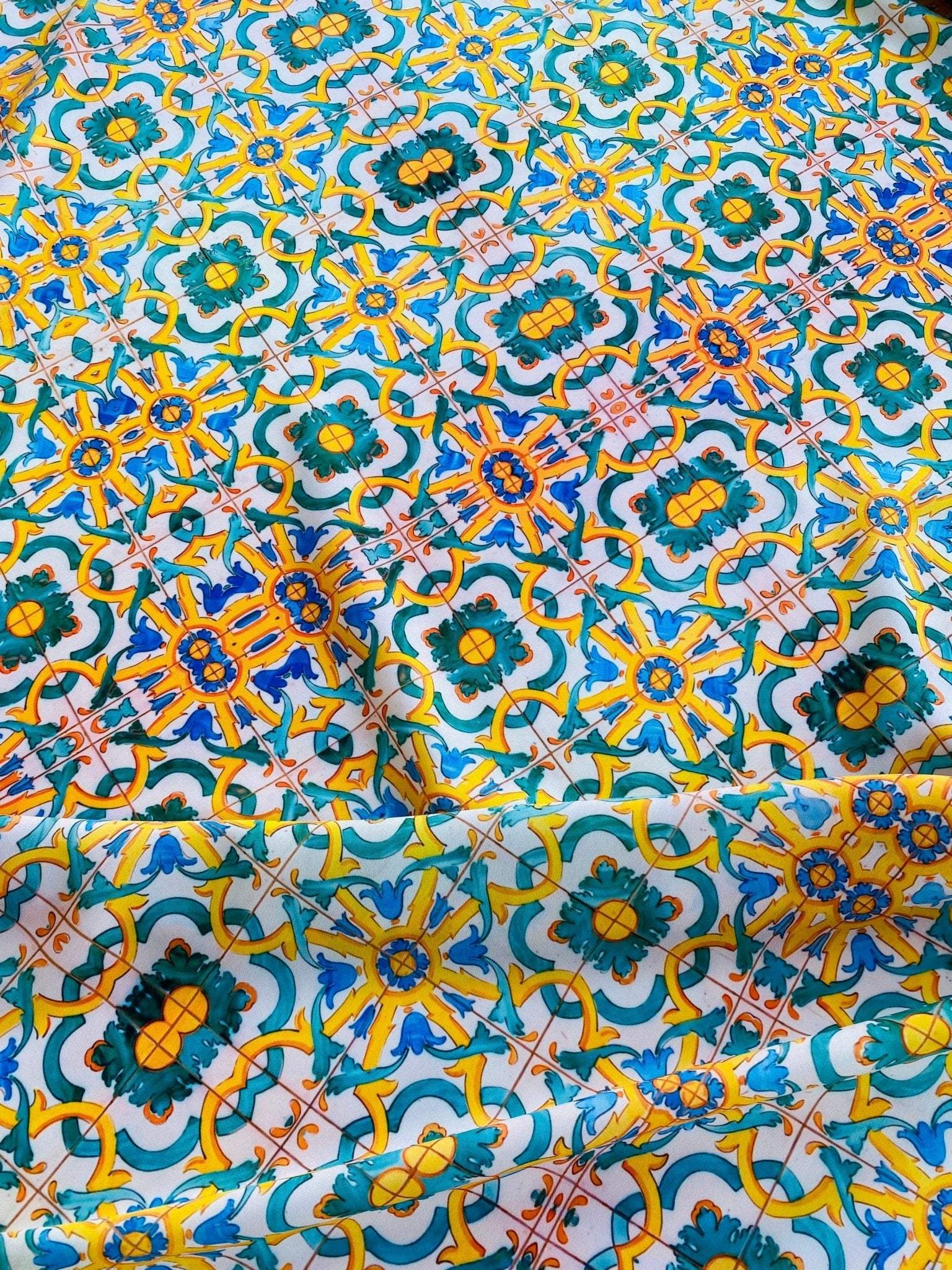 Yellow, blue, and green Mediterranean tile print fabric with intricate geometric pattern and vibrant colors, 150cm width