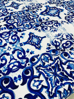 Majolica pattern outdoor fabric with vibrant blue intricate design, weather-resistant upholstery material for outdoor use