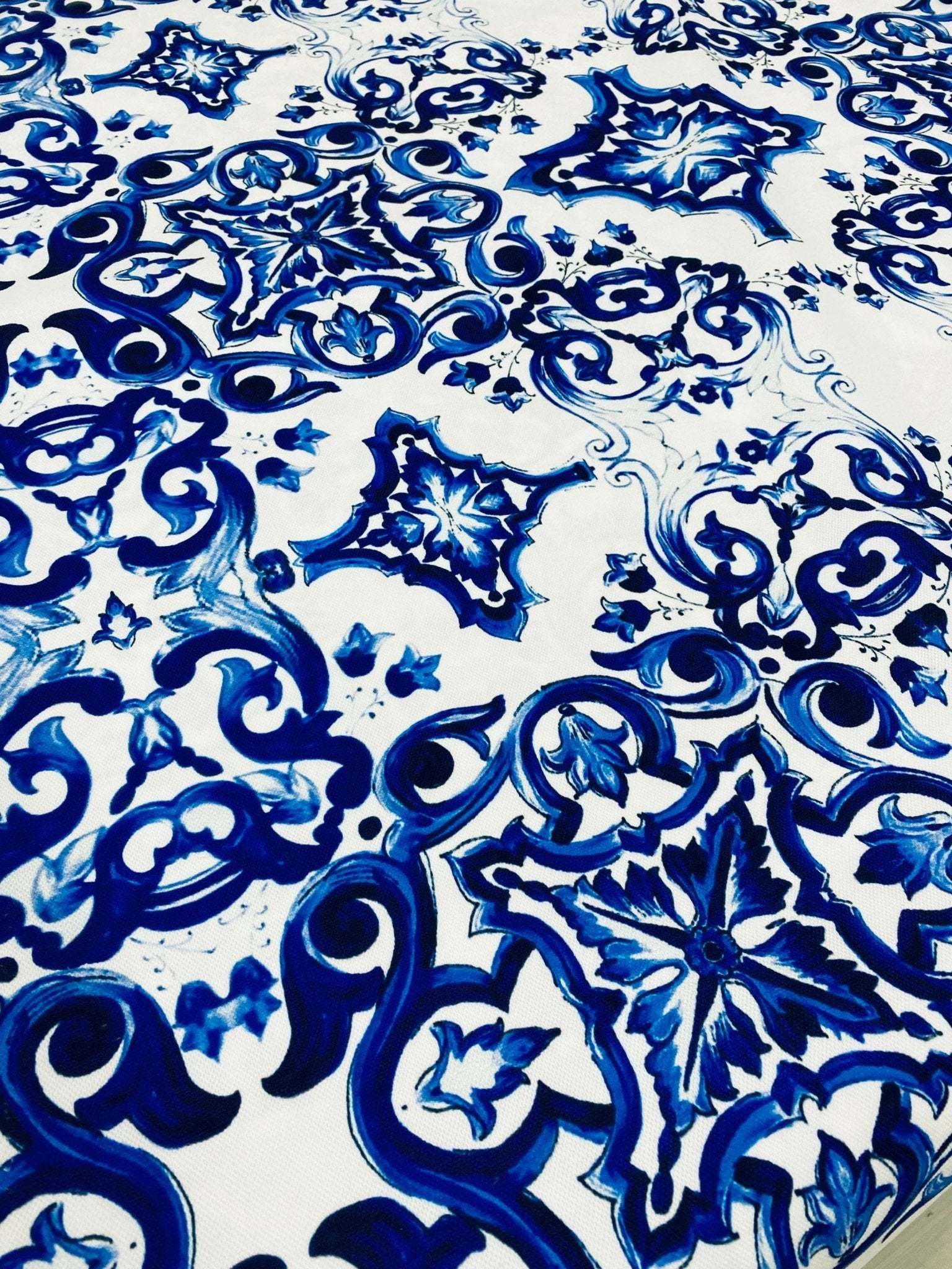 Majolica pattern outdoor fabric with vibrant blue intricate design, weather-resistant upholstery material for outdoor use