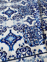 Majolica pattern outdoor fabric with blue intricate design on white background, weather-resistant upholstery material for outdoor use