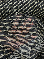 Black zigzag mesh lace fabric with intricate pattern and elegant texture for sophisticated fashion designs