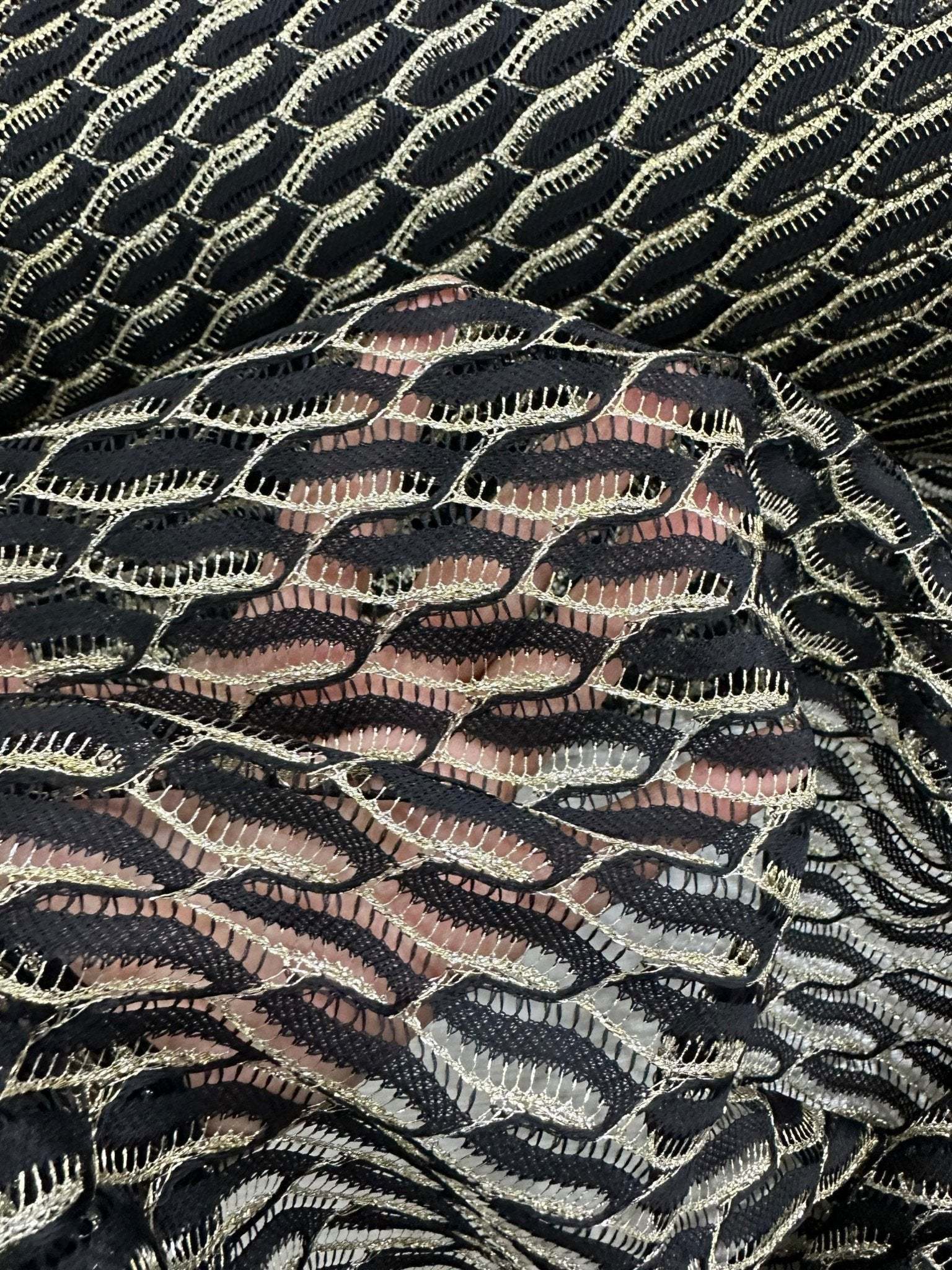 Black zigzag mesh lace fabric with intricate pattern and elegant texture for sophisticated fashion designs