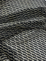 Black zigzag patterned mesh lace fabric with intricate texture for elegant clothing designs