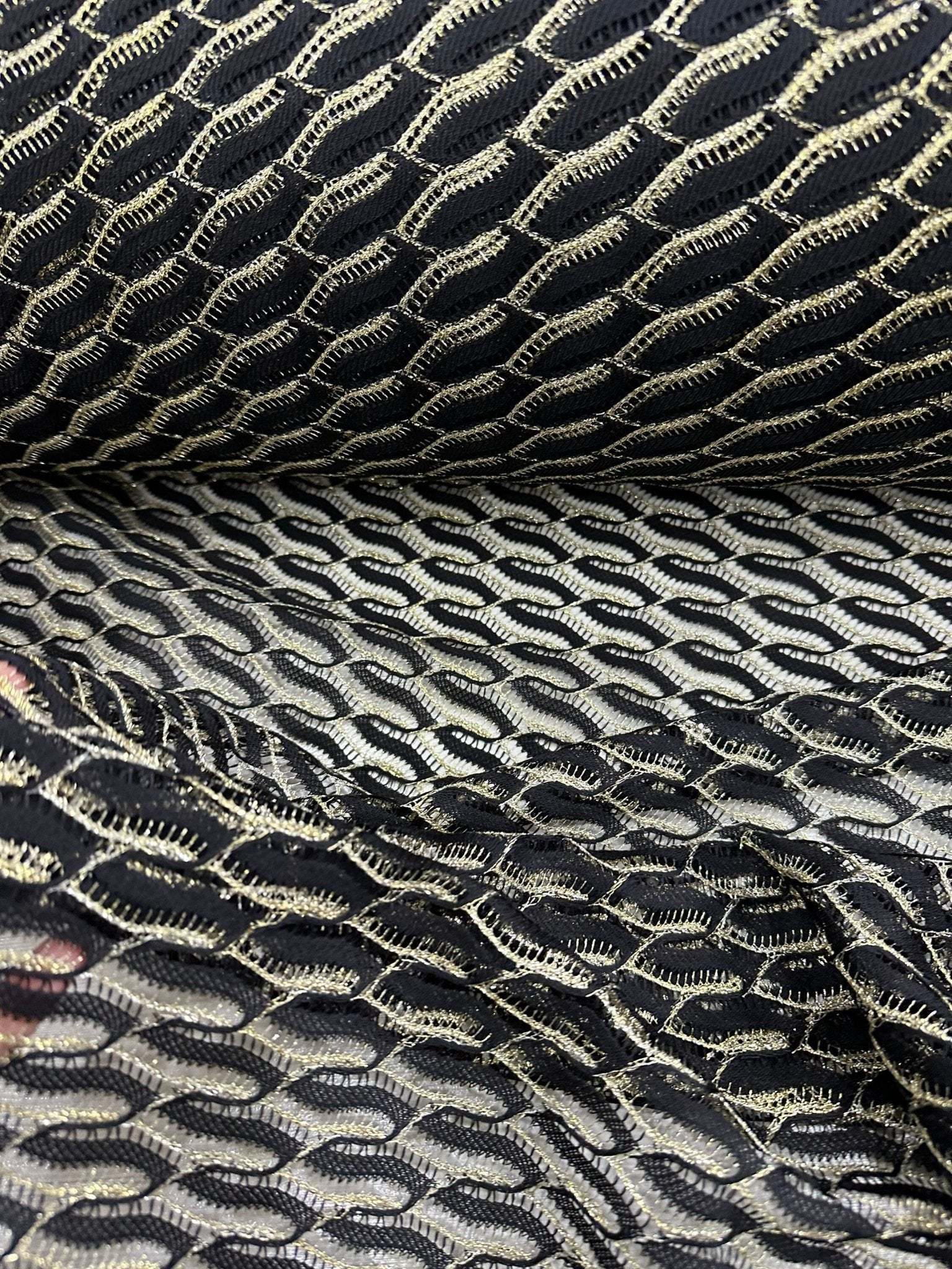 Black zigzag mesh lace fabric with intricate pattern for elegant fashion designs