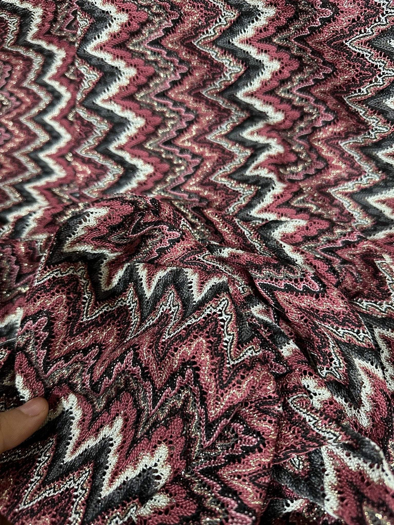 Bordeaux Zigzag Mesh knit jersey fabric with shiny zigzag pattern in burgundy, black, and white colors, 150 cm wide textile ideal for fashion projects