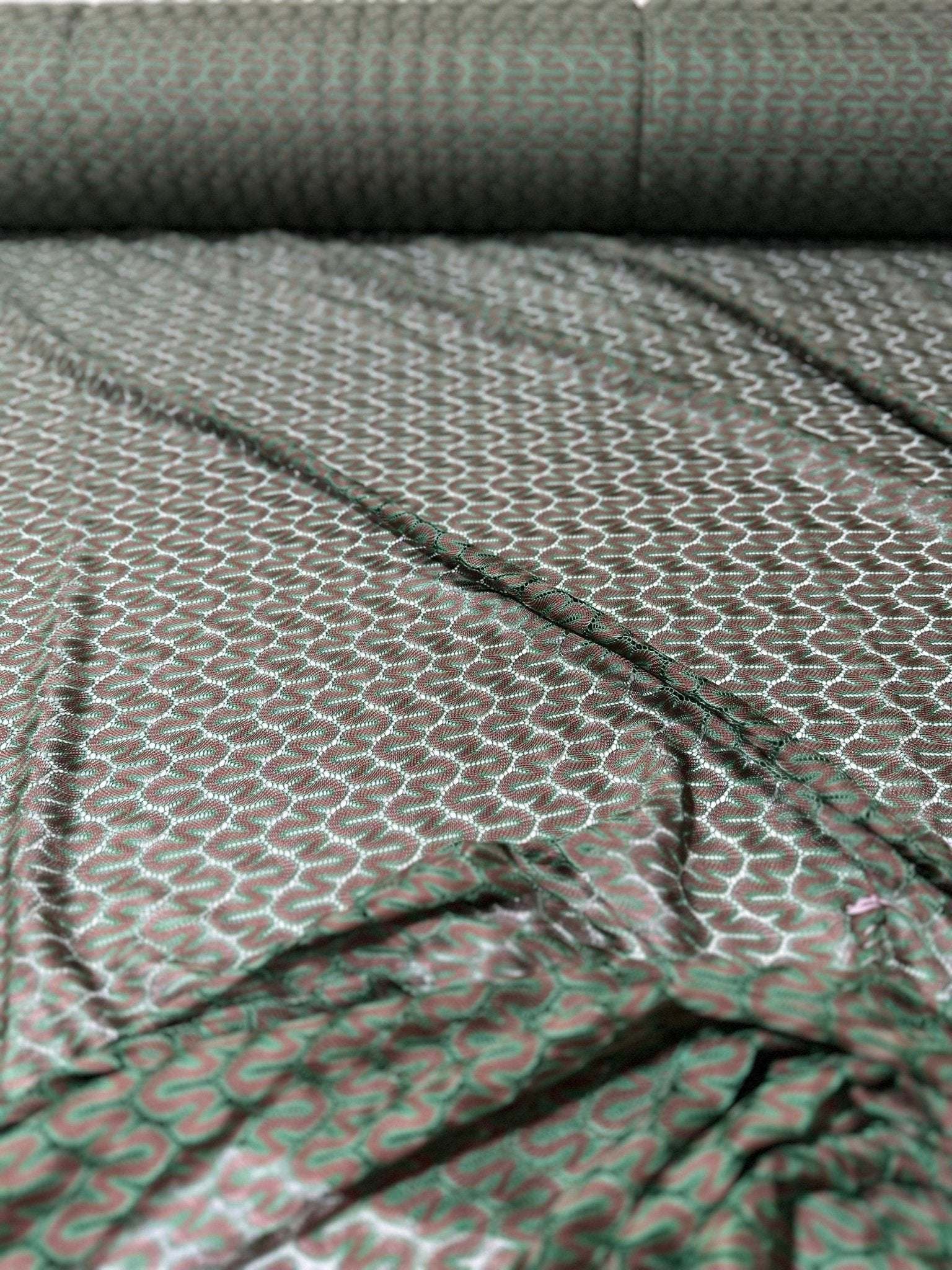 Green and Brown Zigzag Knit Jersey Mesh Fabric with textured zigzag pattern, 150 cm wide, lightweight and durable textile for apparel.