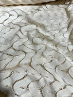 Off-White zigzag knit jersey fabric in breathable mesh with textured pattern for sewing projects